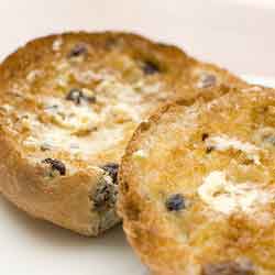 a toasted and buttered currant teacake